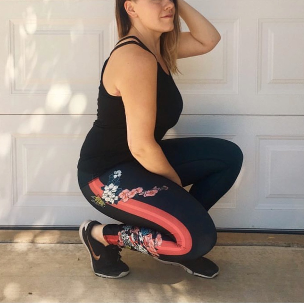 Black workout leggings with red stripe and floral